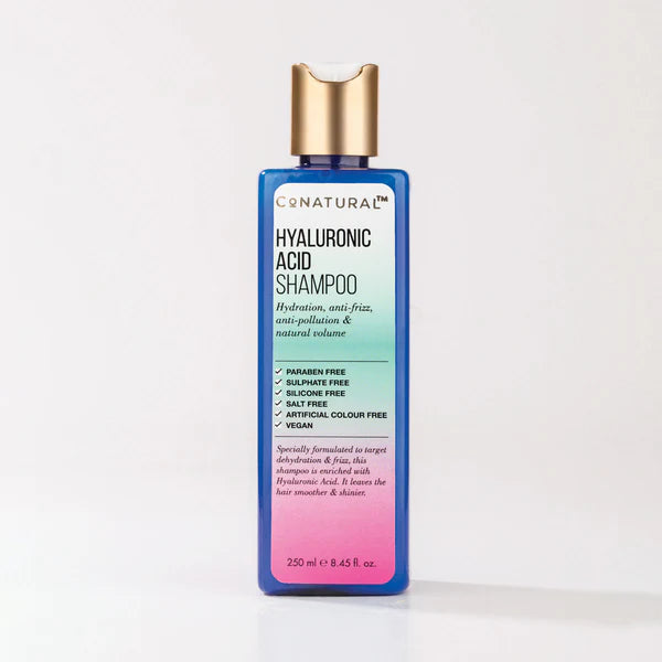 Bottle of CoNatural Hyaluronic Acid Shampoo, 250ml with a colorful label indicating it is vegan, cruelty-free, and paraben-free.