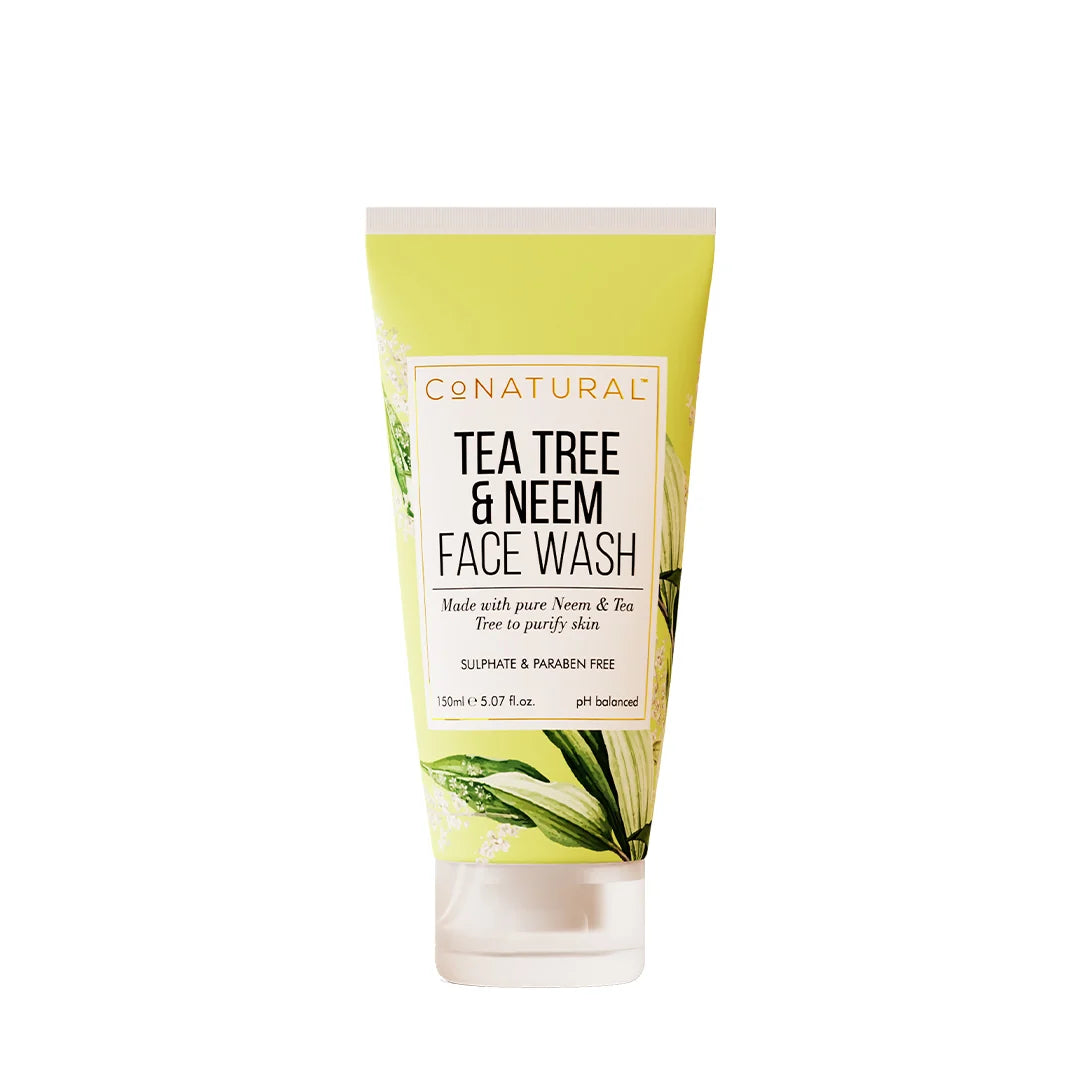 Tube of tea tree and neem face wash with green leaf design on a white background